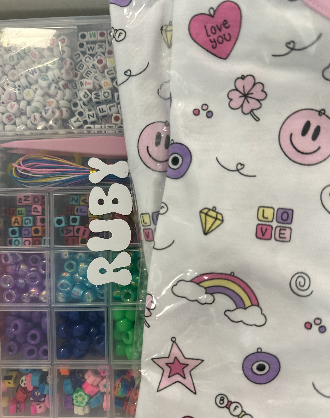 Baby Noomie influencer box with pajamas and personalized bead kit