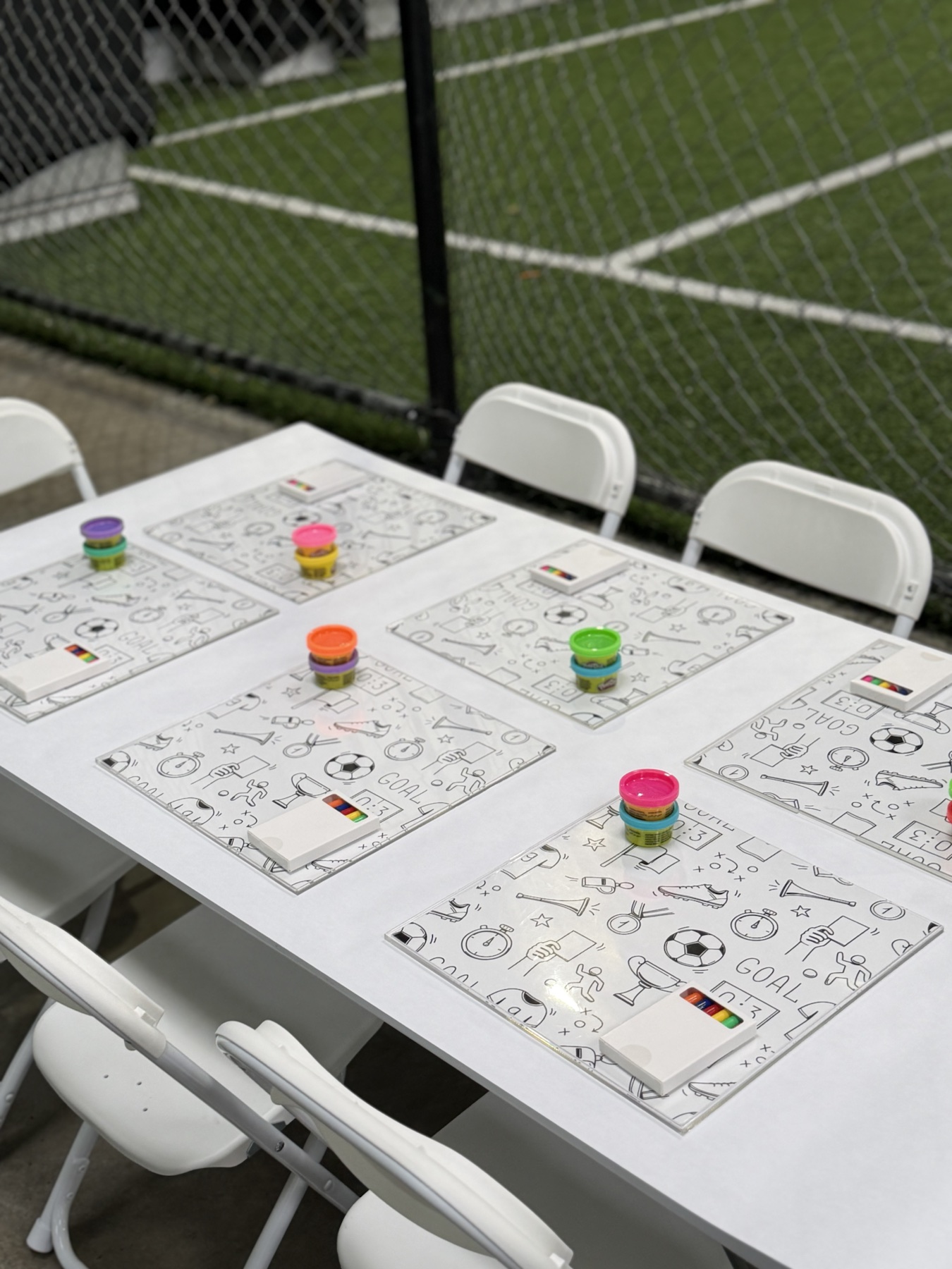 Sports-themed FUNTable activity mats prepared for a children's event
